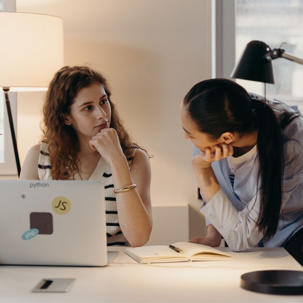 two women engaged in deep conversation