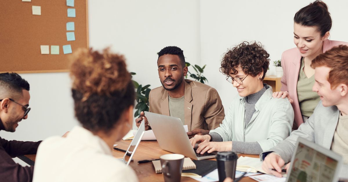 Image of team working together on computers